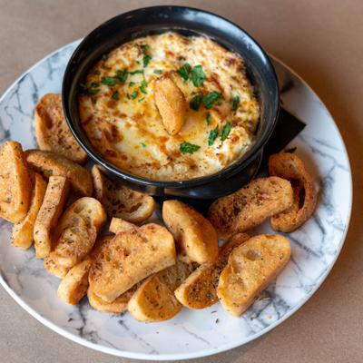 Warm crab dip with toast.