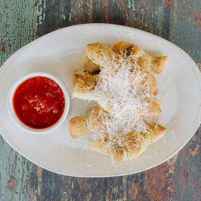 Bread Knots with Parmesan and a side of tomato sauce.