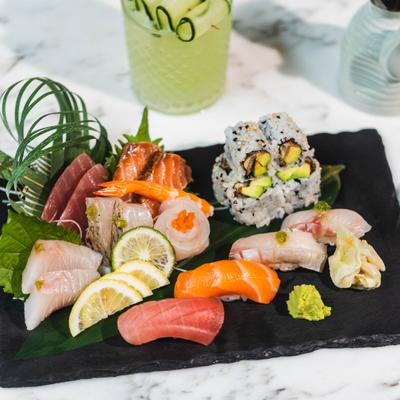 Sushi sashimi combo platter paired with Cucumber Gimlet cocktail.