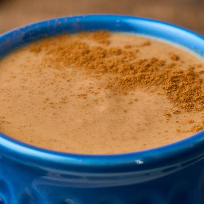 Close-up of Mexican hot chocolate sprinkled with cinnamon.
