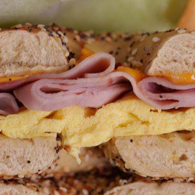 Ham, egg and cheese bagel, close up.