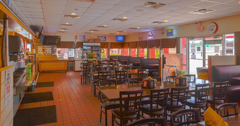 Interior, spacious dining area with tables and chairs