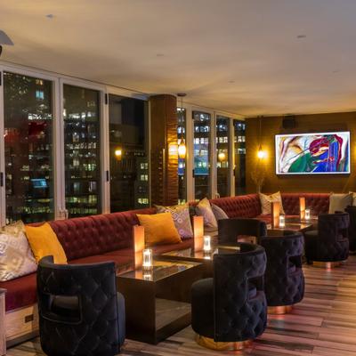 Lounge area, padded armchairs and sofas.