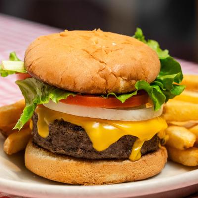 Mama burger with fries on the side.