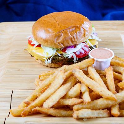 California Veggie Patty with Cheese, with a dipping sauce and fries on the side.