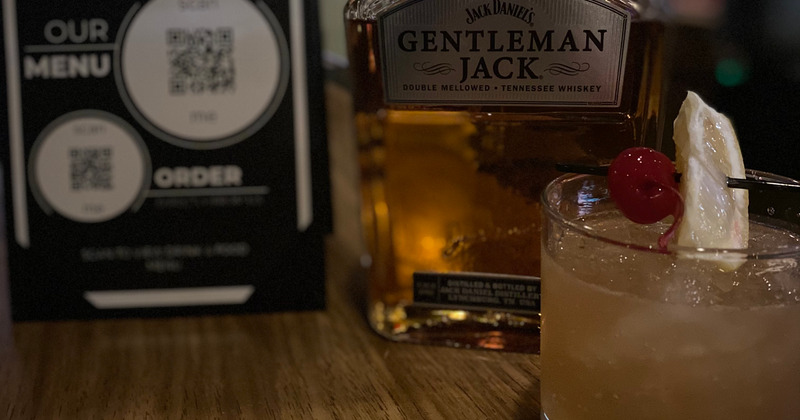 Cocktail and a bottle of whiskey