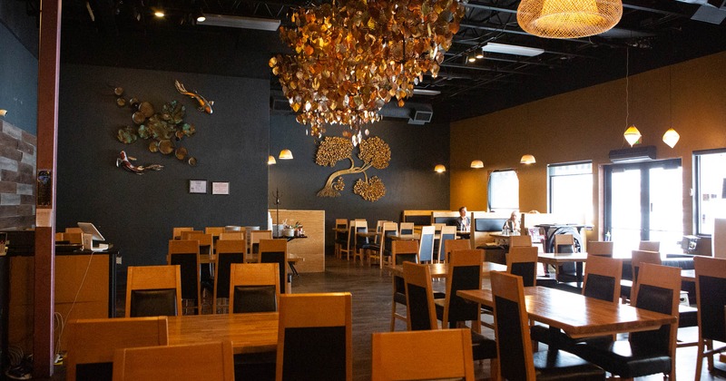 Interior, wide view, tables and chairs lined up