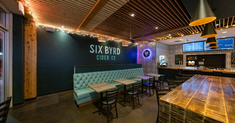 Interior, long banquet seating near bar