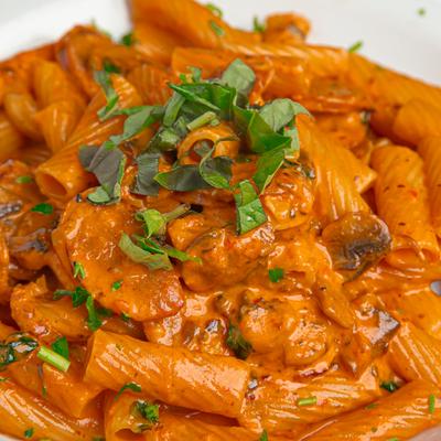 Rigatoni pasta in pink sauce.