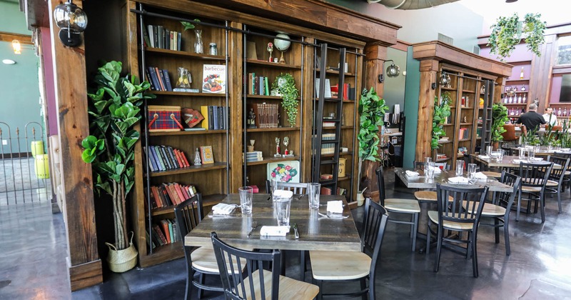 Bookshelf adjacent tables and chairs