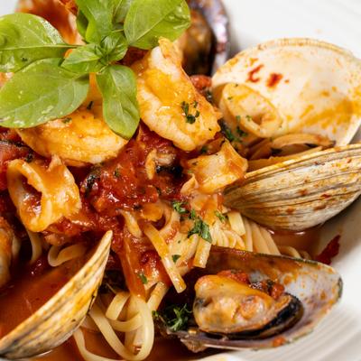Seafood pasta in plum tomato basil sauce.