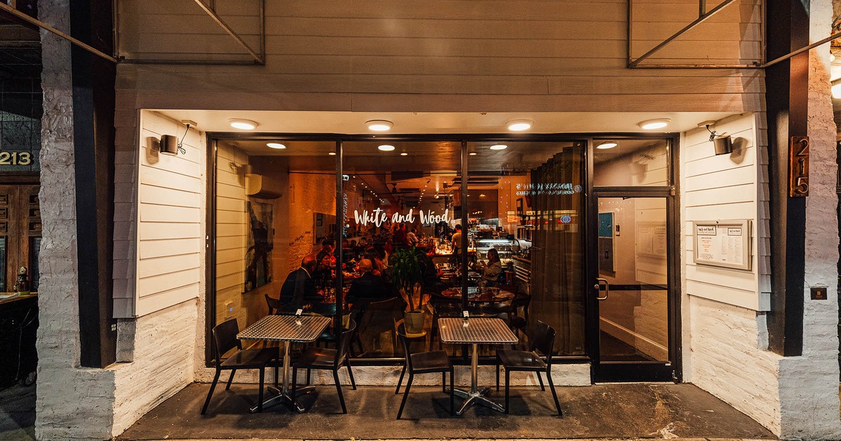 Exterior, tables by the entrance