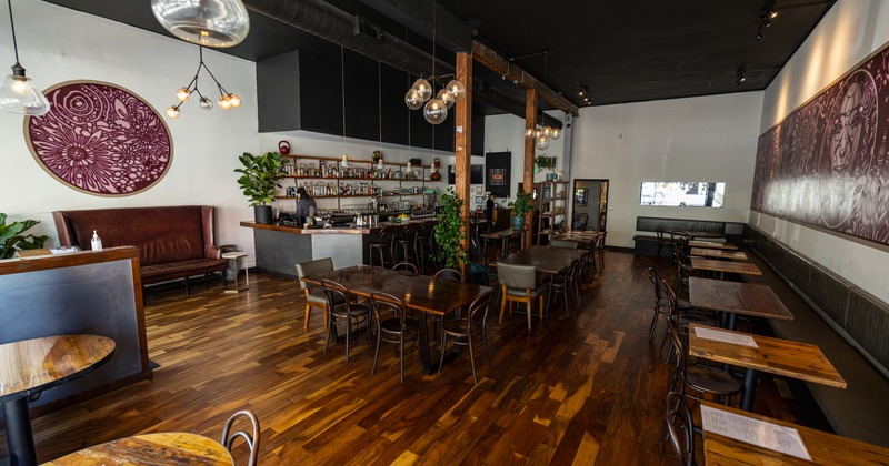 Diner area, tables and chairs, bar behind