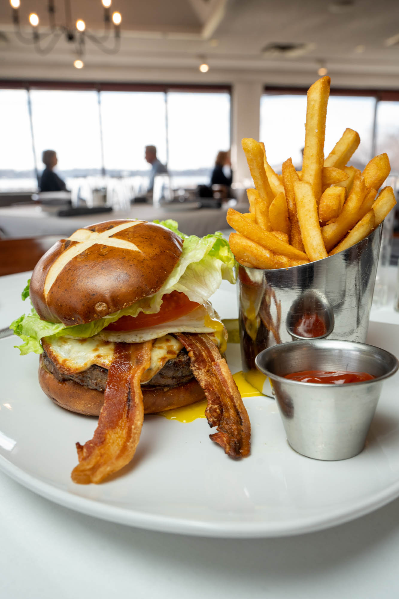 Cheeseburger, with BLT, onion, pickles, fried egg, fries and ketchup