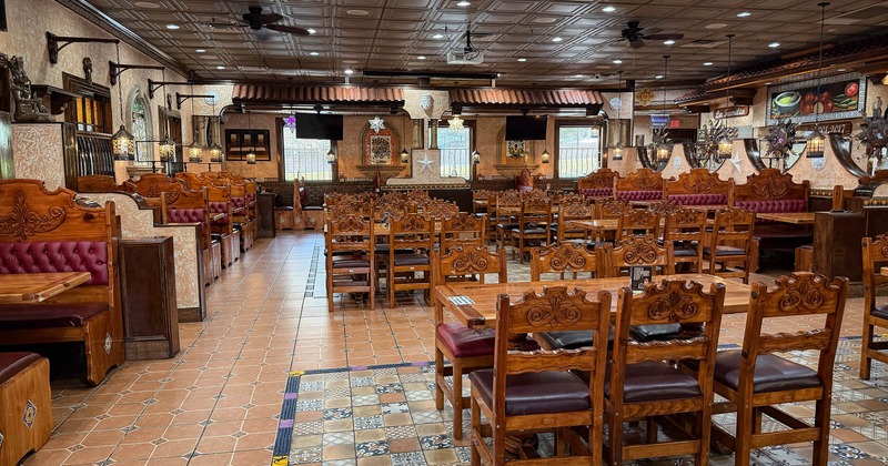 Interior, dining area with tables, chairs and seating leather booths