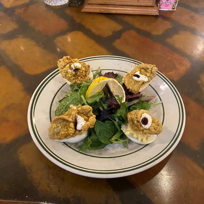 Angels on Horseback--fried oysters atop Deviled eggs with bacon, tartar sauce & basalmic glazec.