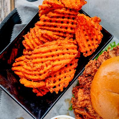 Nashville hot chicken sandwich, with waffle fries and coleslaw.