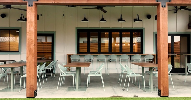 Covered patio, seating area with tables and chairs