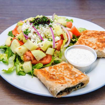 Greek spinach pie, served with mixed vegetable salad and dipping