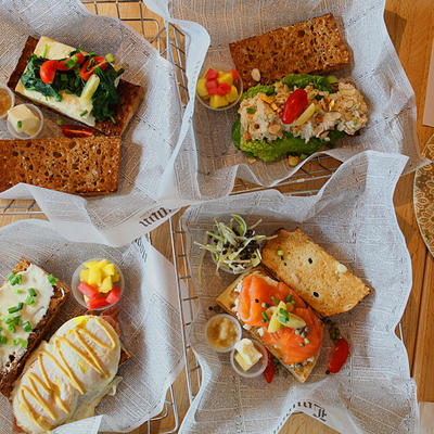 Four different types of sandwiches with cheese and salad