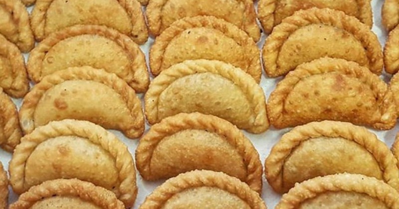 Golden empanadas with a crimped edge and freshly baked