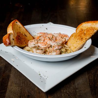 Shrimp linguine pasta served with garlic toast.