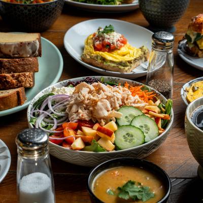 Various meals and spices on the table.