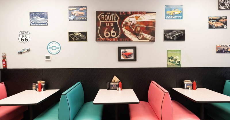 Booth by wall, painting above