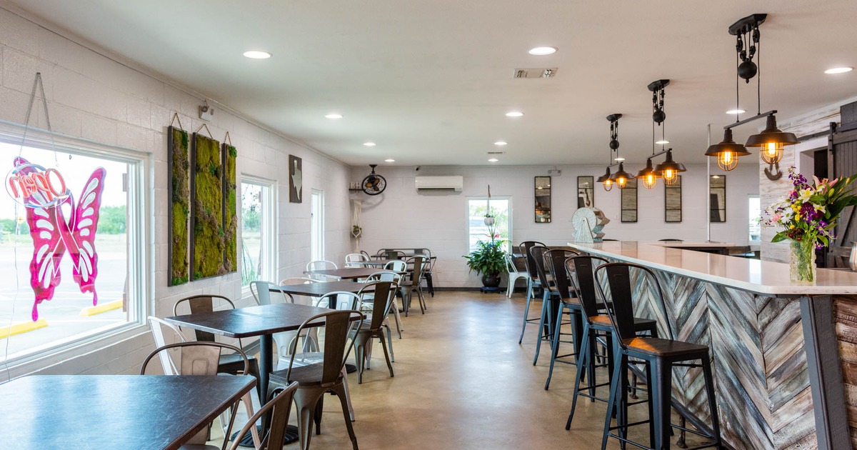 Lined up tables and chairs, bar