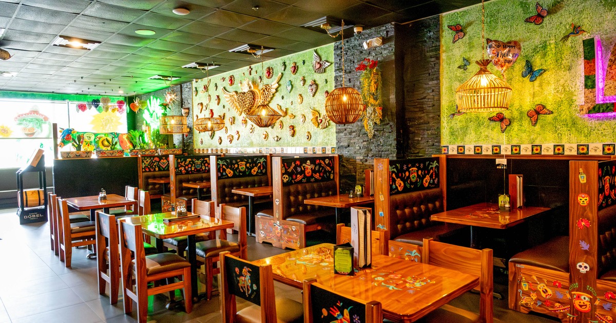 Interior, seating area with wooden booths, tables and chairs