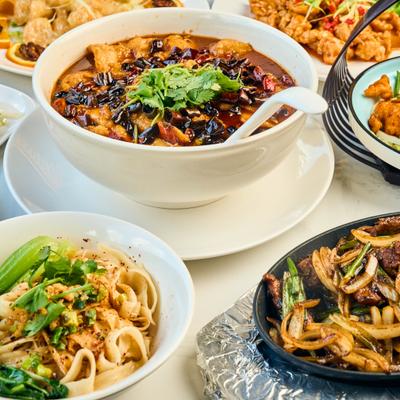 Assortment of dishes spread on a table.