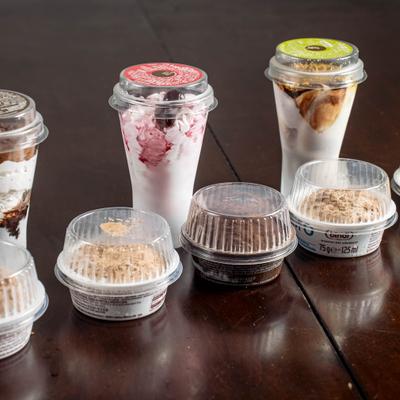 Assorted single-serve packaged Italian desserts displayed on a wooden table.
