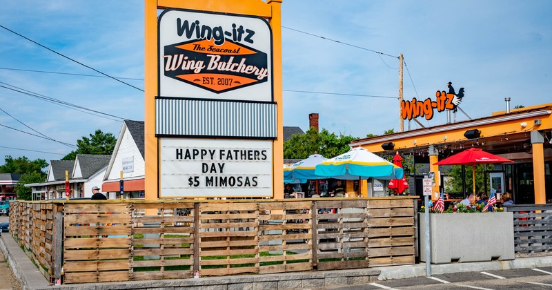 Exterior, entrance to patio, totem sign, parking lot