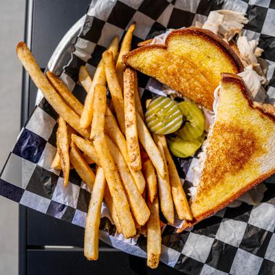 Turkey melt with French fries.