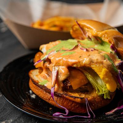 Burger with green sauce.