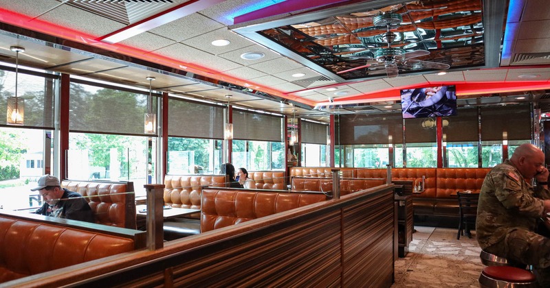 Interior, seating booths, guests enjoying lunch