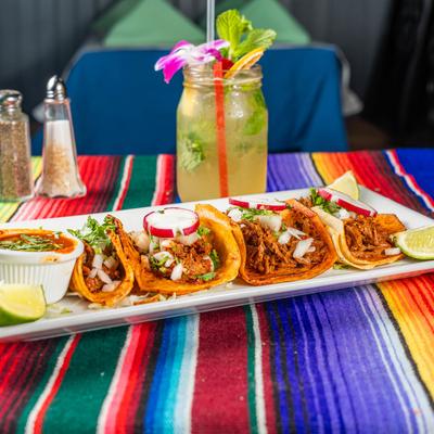 Birria taco plate with a Mojito.