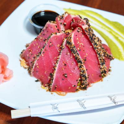 Seared Yellowfin Tuna, scallions, cabbage, soy sauce, and wasabi.