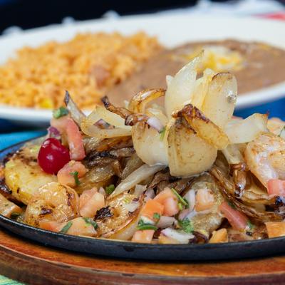 Grilled chicken breast with shrimp topped with pineapple and pico de gallo.