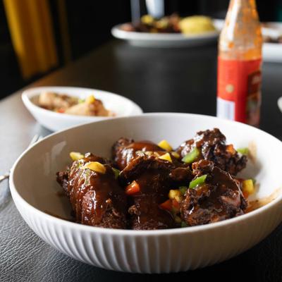 Jerk Wings garnished with diced wegetables.