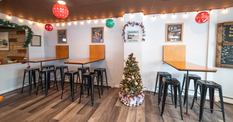 Interior with holiday decorations, string lights, and hanging ornaments
