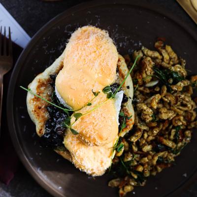 Eggs Benedict on fry bread with mushrooms and parmesan.