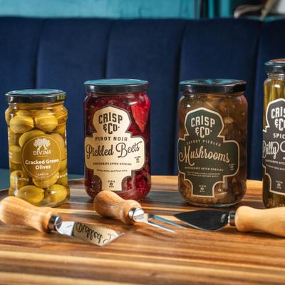 Jar of olives, pickled beets, and pickled mushrooms.