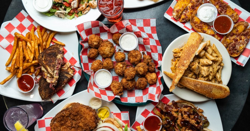 Overhead view of the variety do dishes served on the table beside a drink