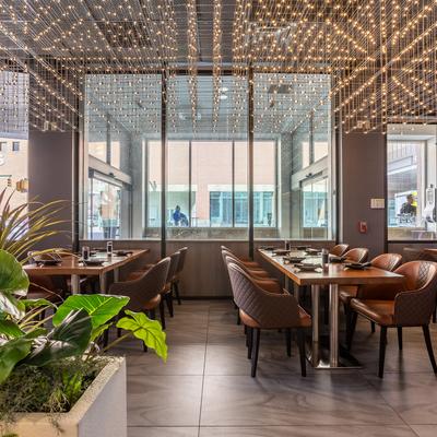 Restaurant interior, tables set up for dining.
