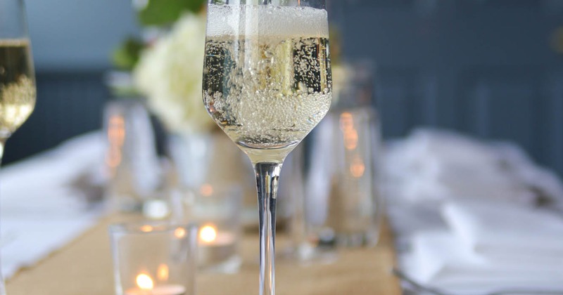 Table setting with a glass of sparkling wine