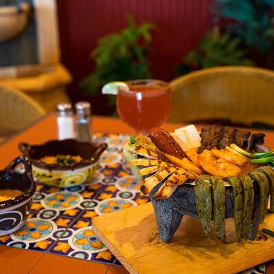 Seafood, vegetables and meats variety in a stone bowl