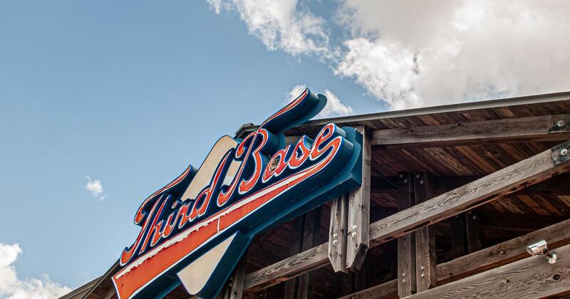 Exterior, the bar's logo at the roof