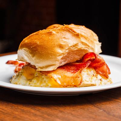Bacon, egg, and cheese breakfast sandwich on a roll.