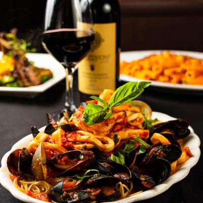 Mixed seafood pasta in marinara sauce.